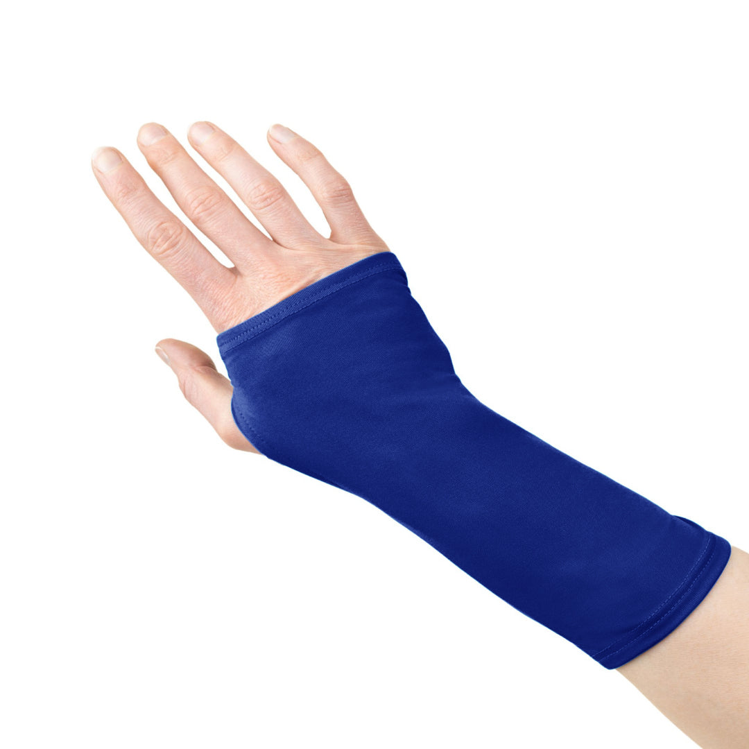 A hand wearing a cobalt blue wrist brace cover that extends from the knuckles to just below the forearm, leaving the fingers free.