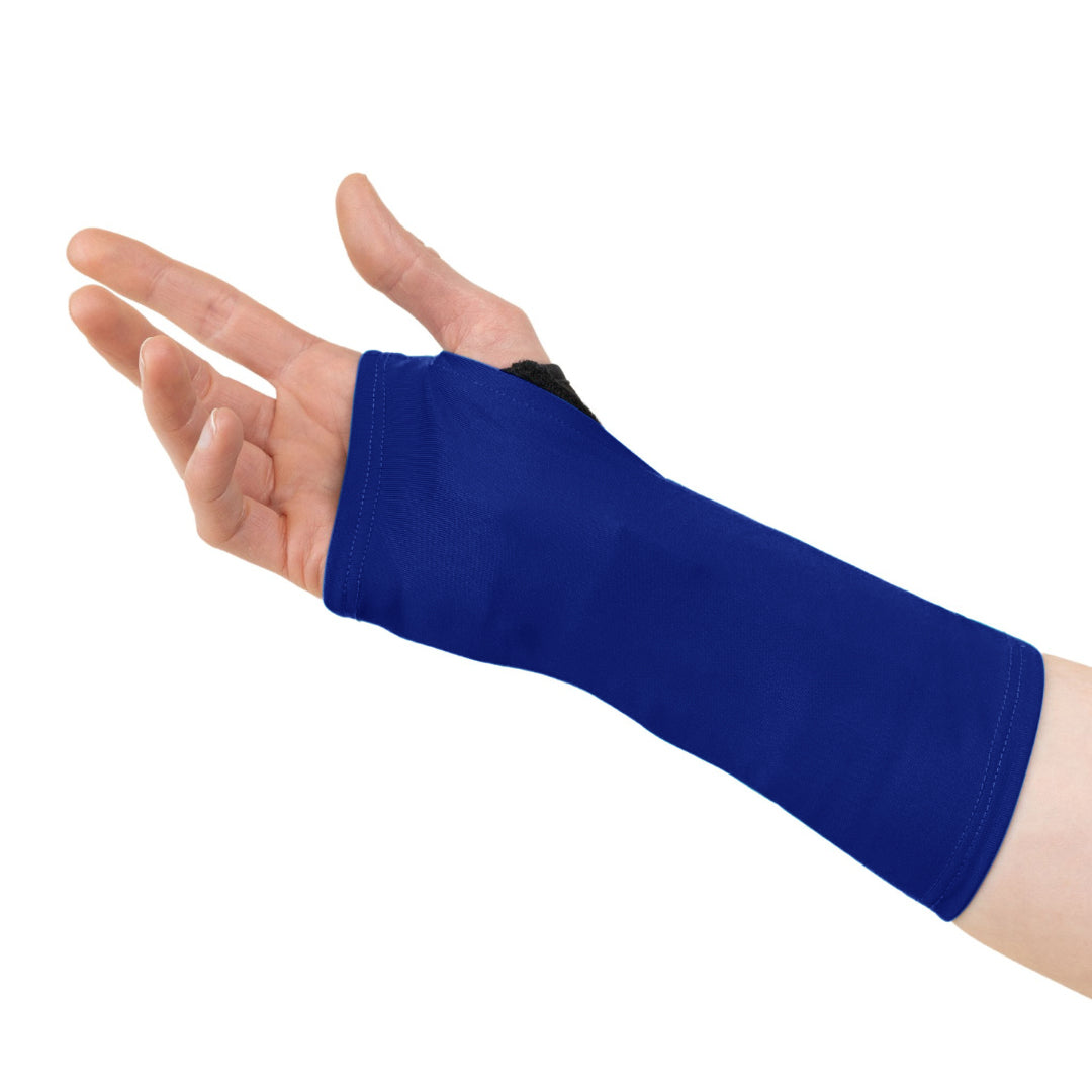 A hand wearing a cobalt blue wrist brace cover that extends from the knuckles to just below the forearm, leaving the fingers free.