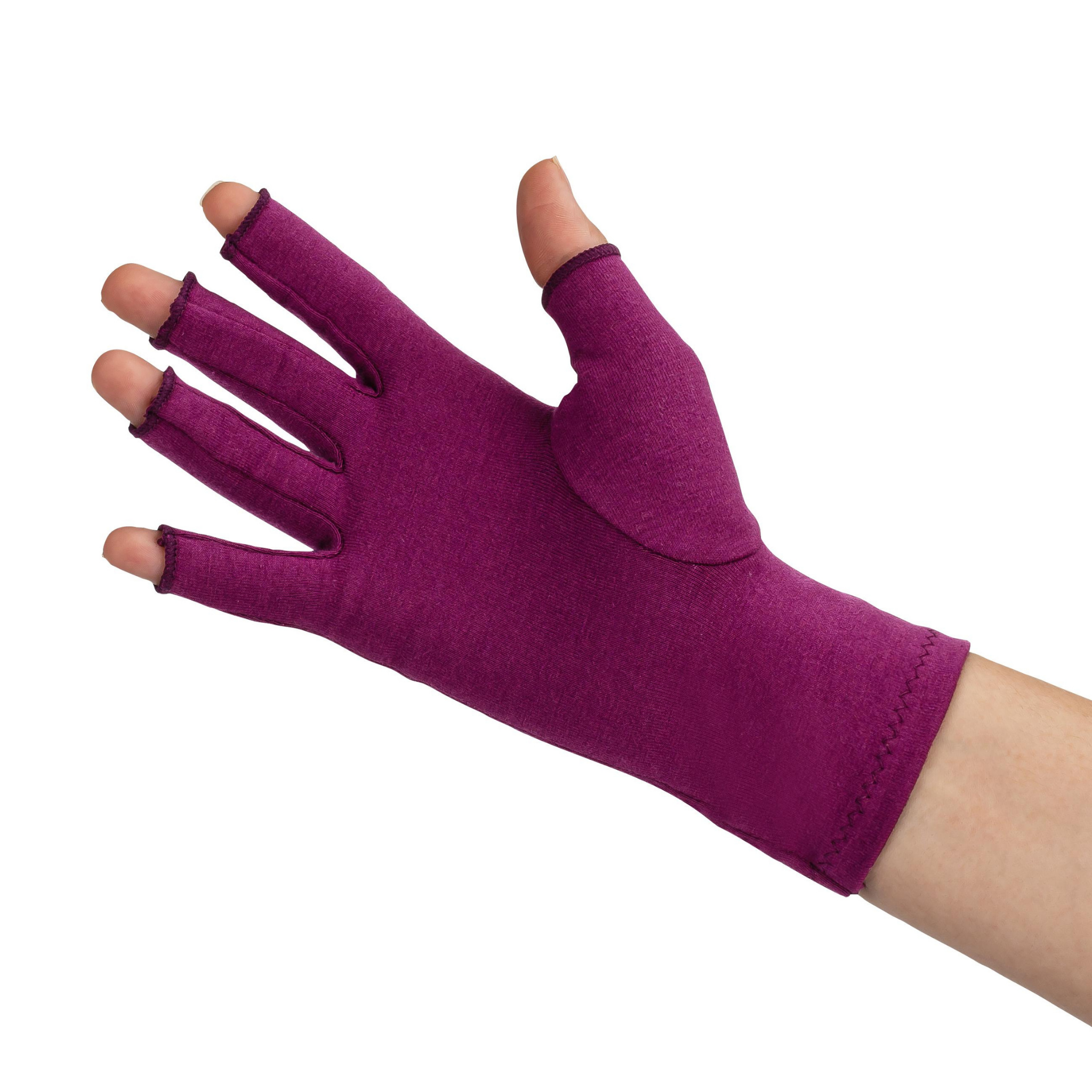 A close up of the hand of a woman with arthritis, wearing a Plum Purple Compression Glove and showing the palm of her hand.